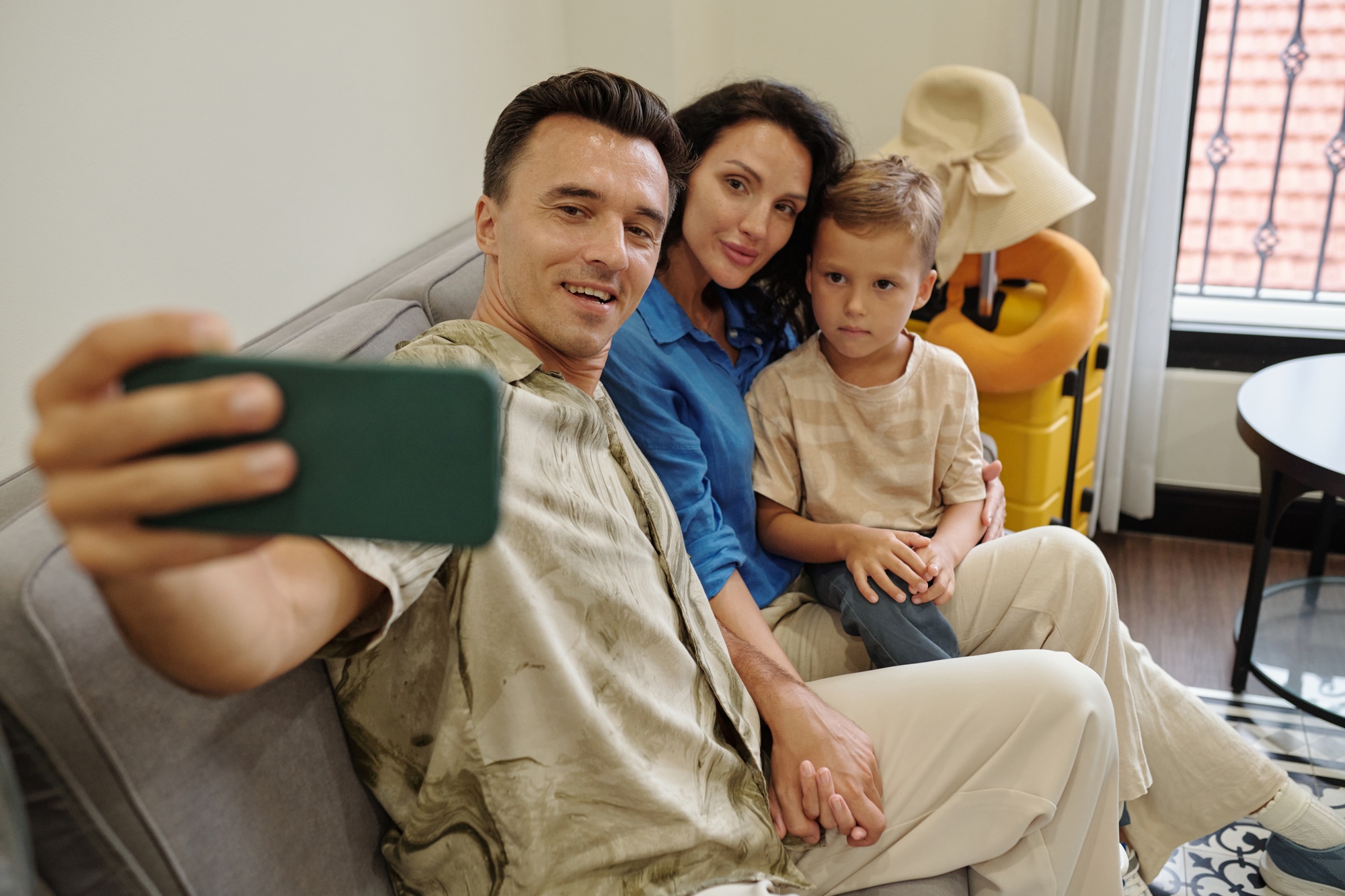 Taking Family Selfie on Comfortable Couch